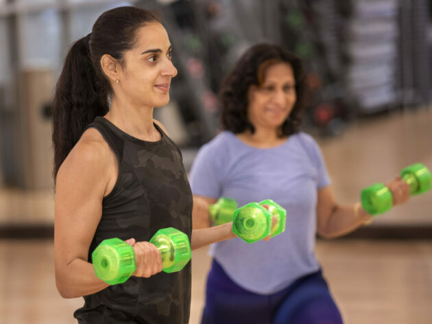 women in group fitness classes