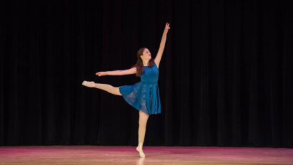 Solo ballet performance on stage.