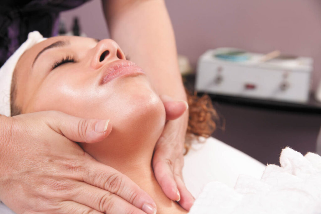 Woman getting a facial massage.