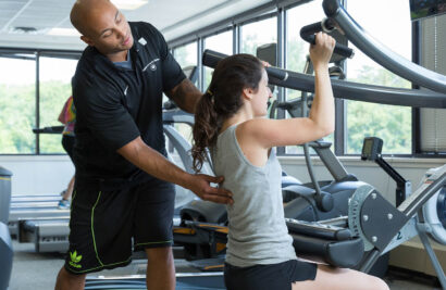 Woman being trained by a personal trainer.