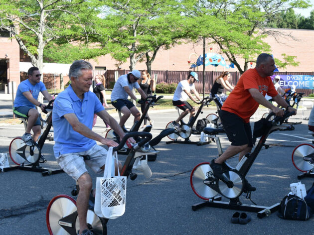 People riding on stationary bikes.
