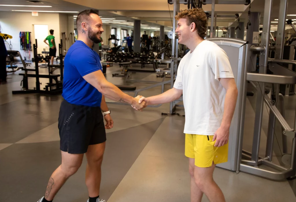 Personal Trainer welcoming a student at Kaplen JCC on the Palisades