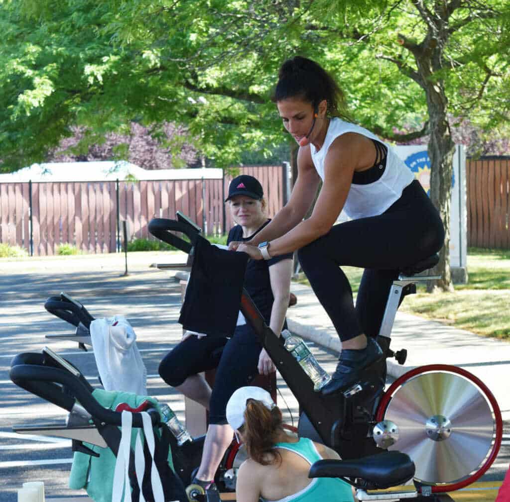 Instructor leading a dynamic cycling class at Kaplen JCC on the Palisades.
