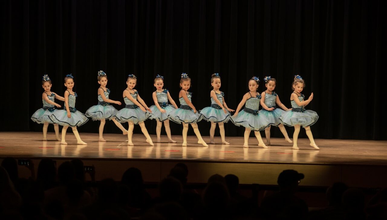 Girls performing on stage.