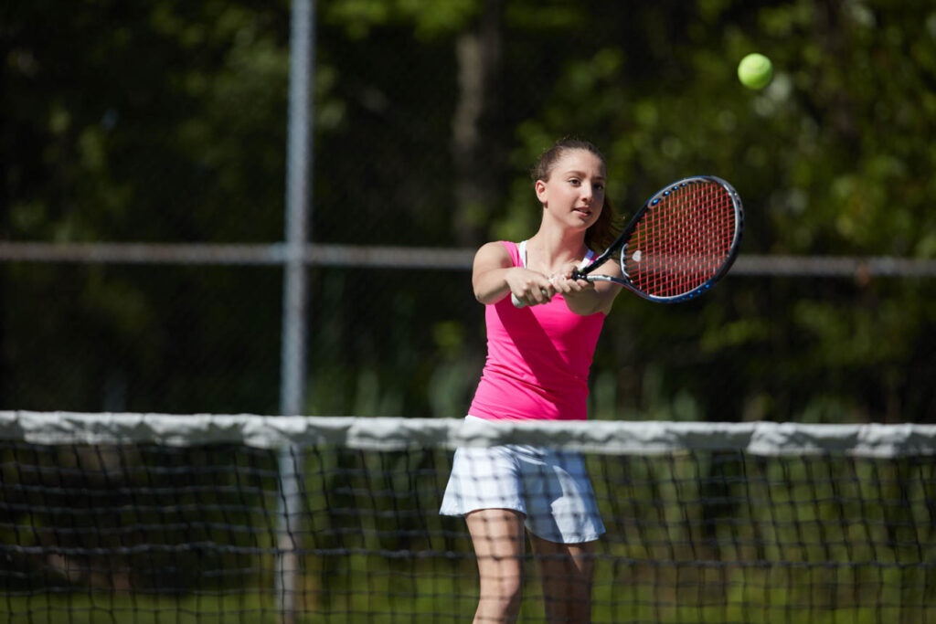 Girl playing tennis.