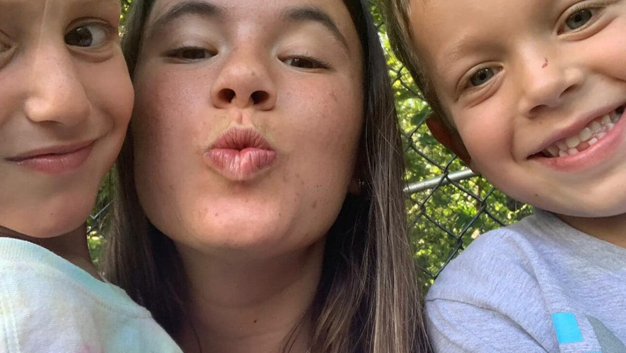 Children smiling in a selfie.
