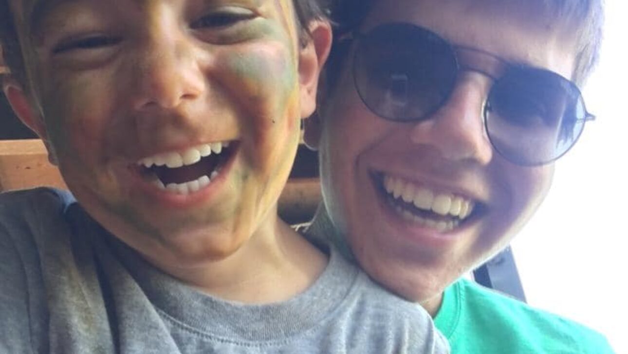 Children smiling in a selfie.