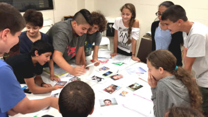 Group of teens working on a project together.