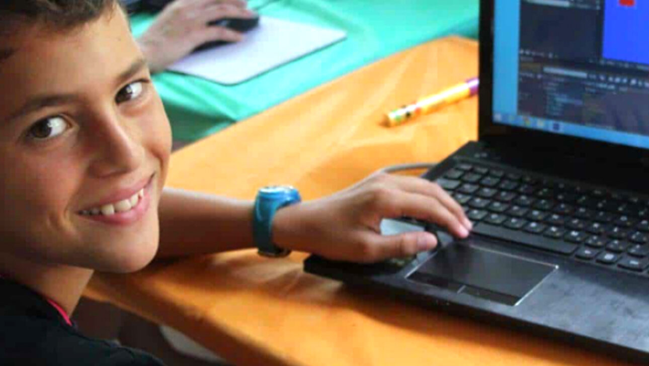 Children smiling doing group activities.